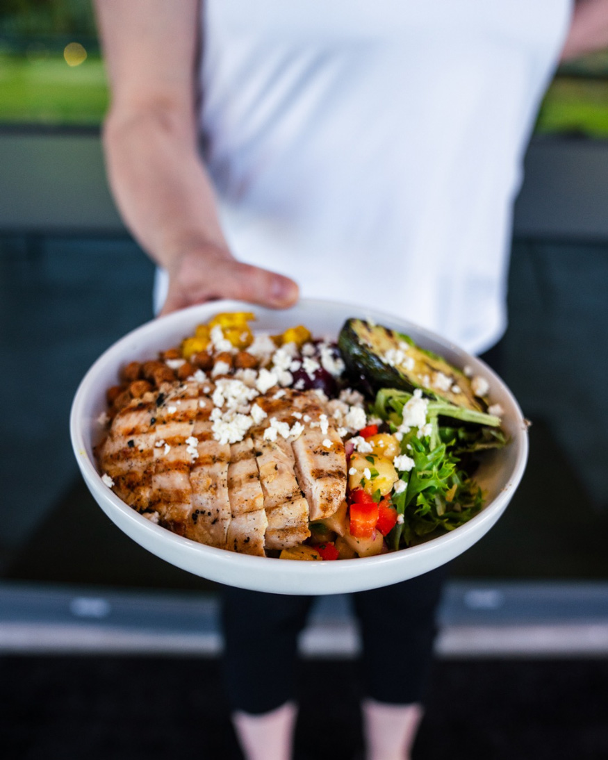 Person-serving-large-bowl-of-food-Pitt-Meadows-Golf-Club