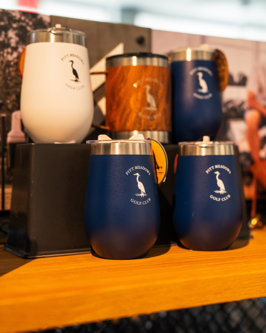 The-image-features-a-collection-of-tumblers-with-a-golf-club-logo-Pitt-Meadows-Golf-Club