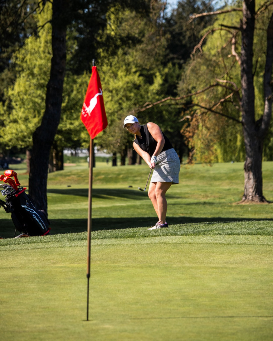 Woman-playing-golf-on-green-course-outdoors-Pitt-Meadows-Golf-Club
